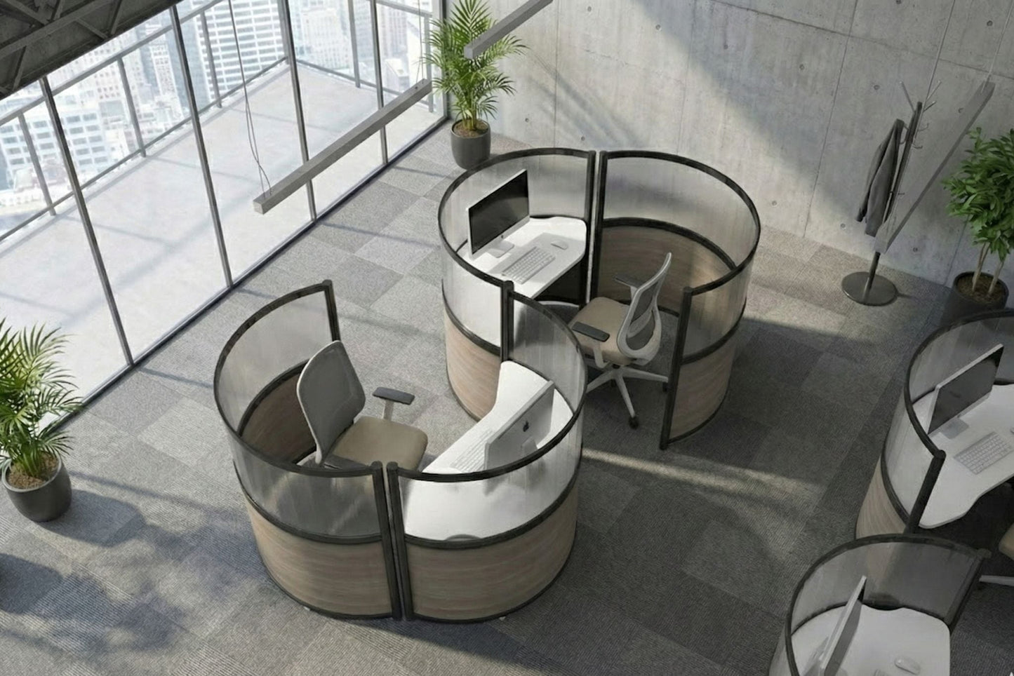 Modern office setup with round workstations and large windows