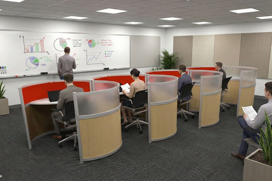 Modern office space with people working at touchdown desks and a whiteboard in the background.