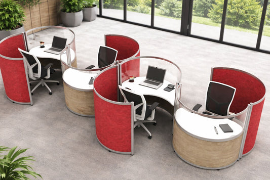 Modern office setup with red and beige partitioned round pod workstations.