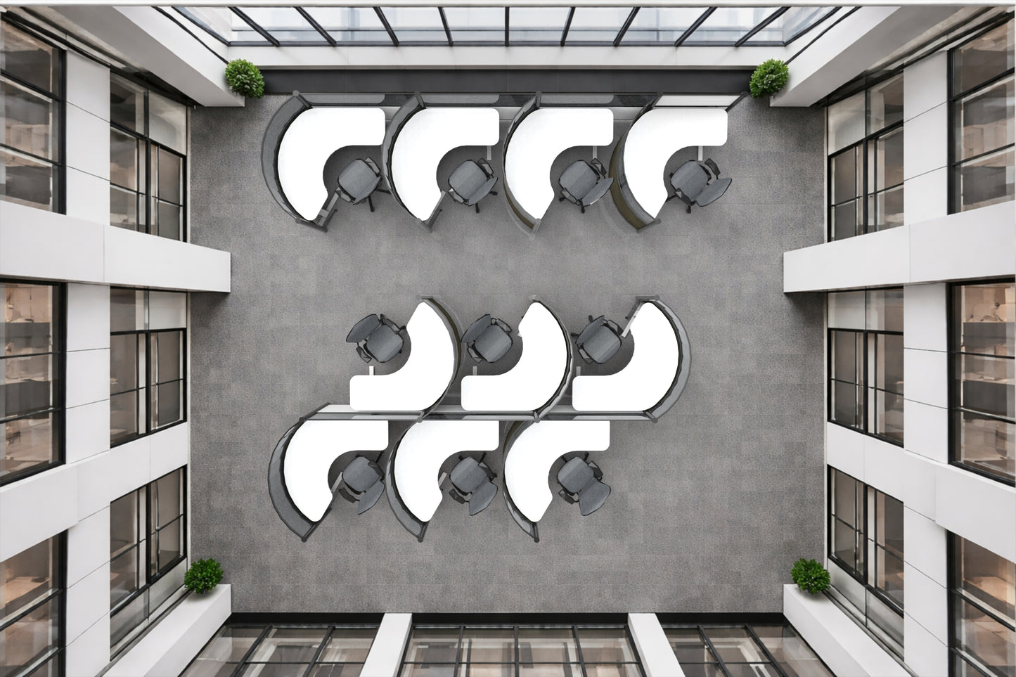 Modern architectural interior with round workstations with geometric wall art and glass ceiling