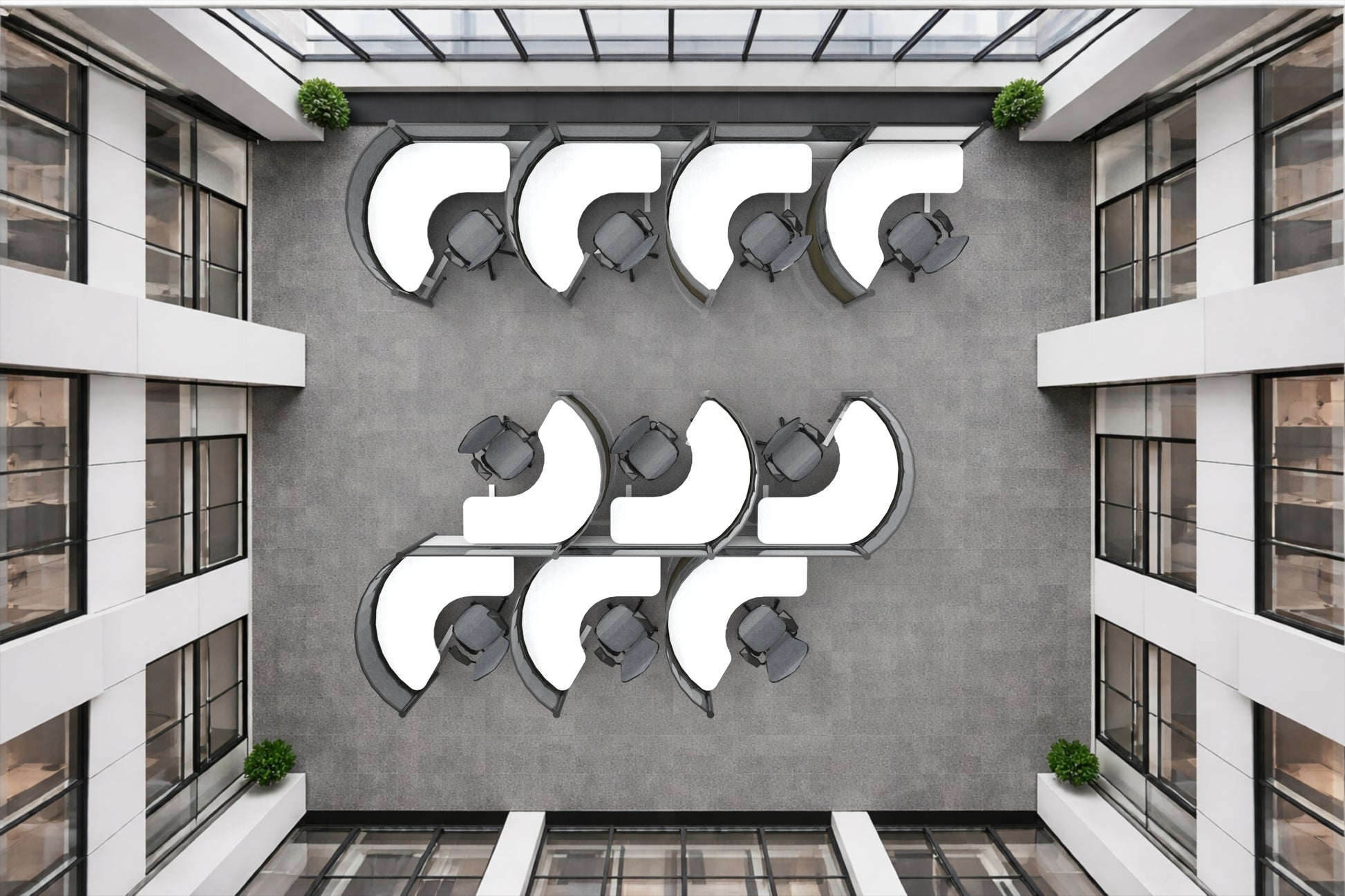 Modern architectural interior with round workstations with geometric wall art and glass ceiling