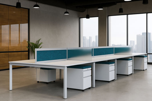 Modern benching office setup with white desks and blue partitions in a bright room.