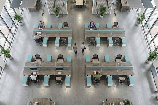 Modern benching style office with open-plan layout, desks, and people working.