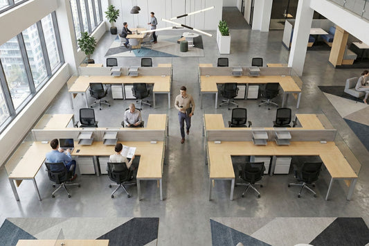Modern open plan office space with employees working at their desks.