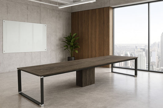 Long wooden conference table in a modern office with large windows and a whiteboard.