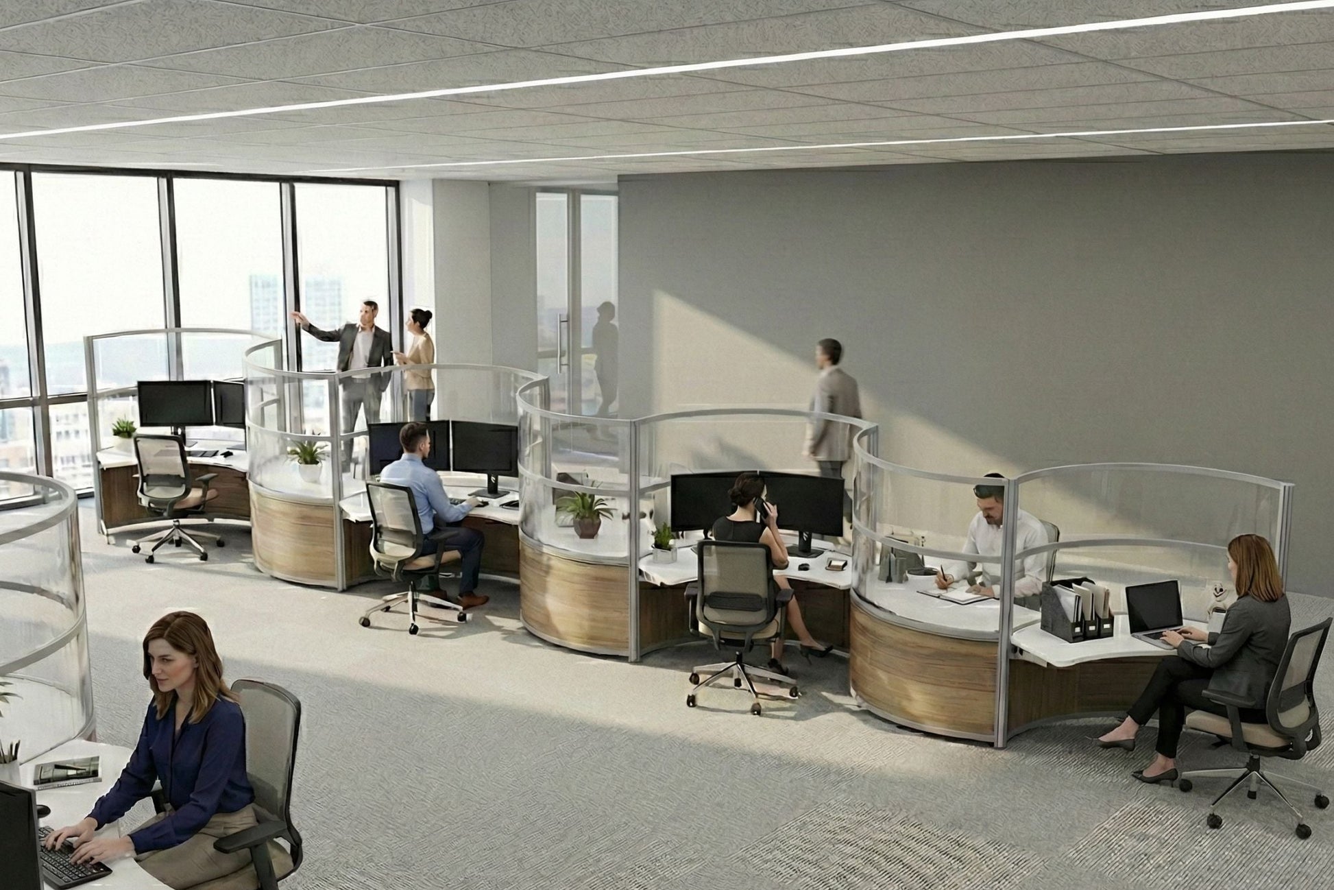 Modern office space with employees working at their desks.
