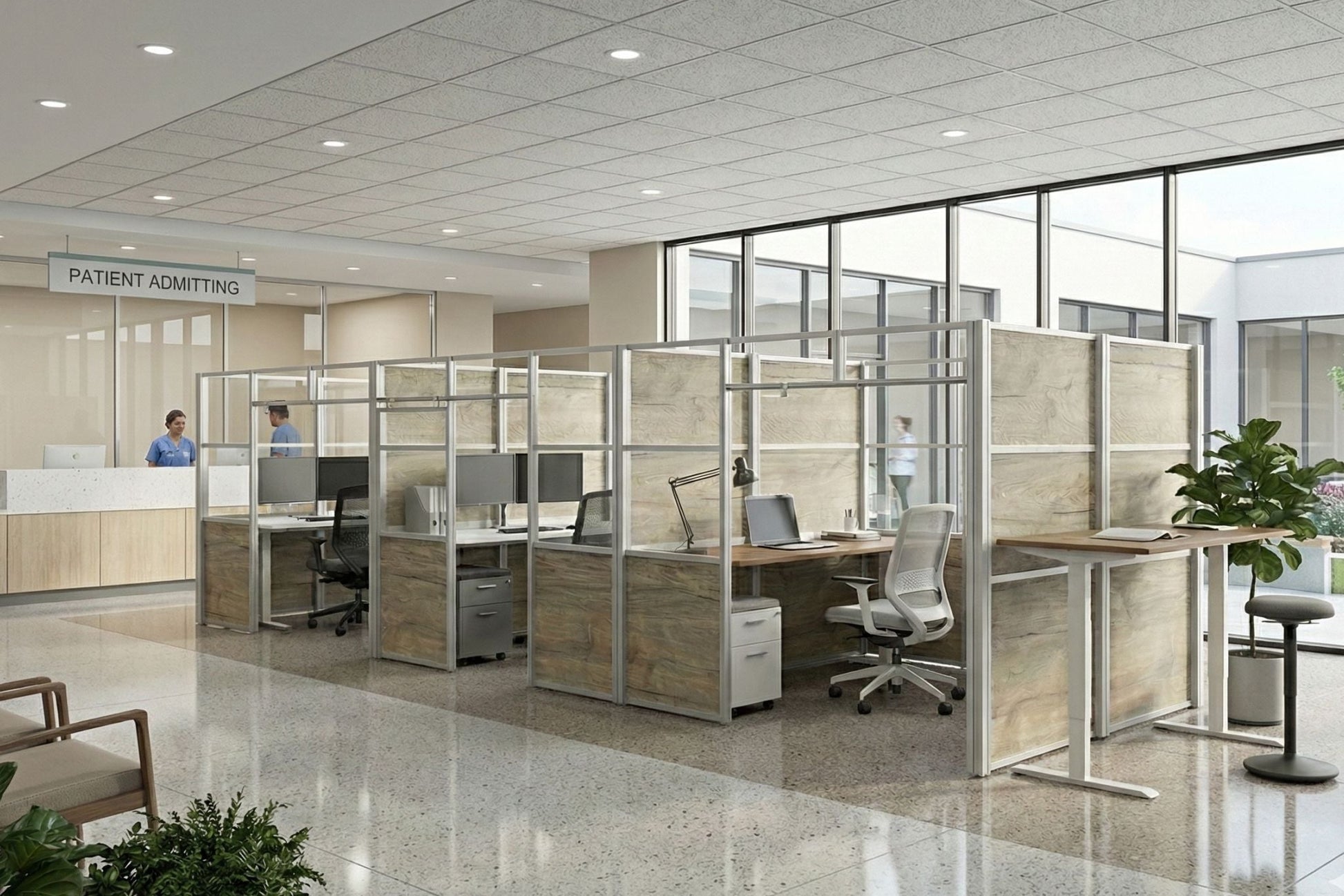Modern office interior with glass partitioned workstations and a patient admitting area.