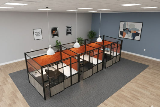 Modern office with glass-walled workstations and orange seating areas.