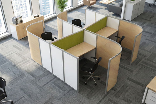 Modern office layout with curved office desks and chairs in a bright room.