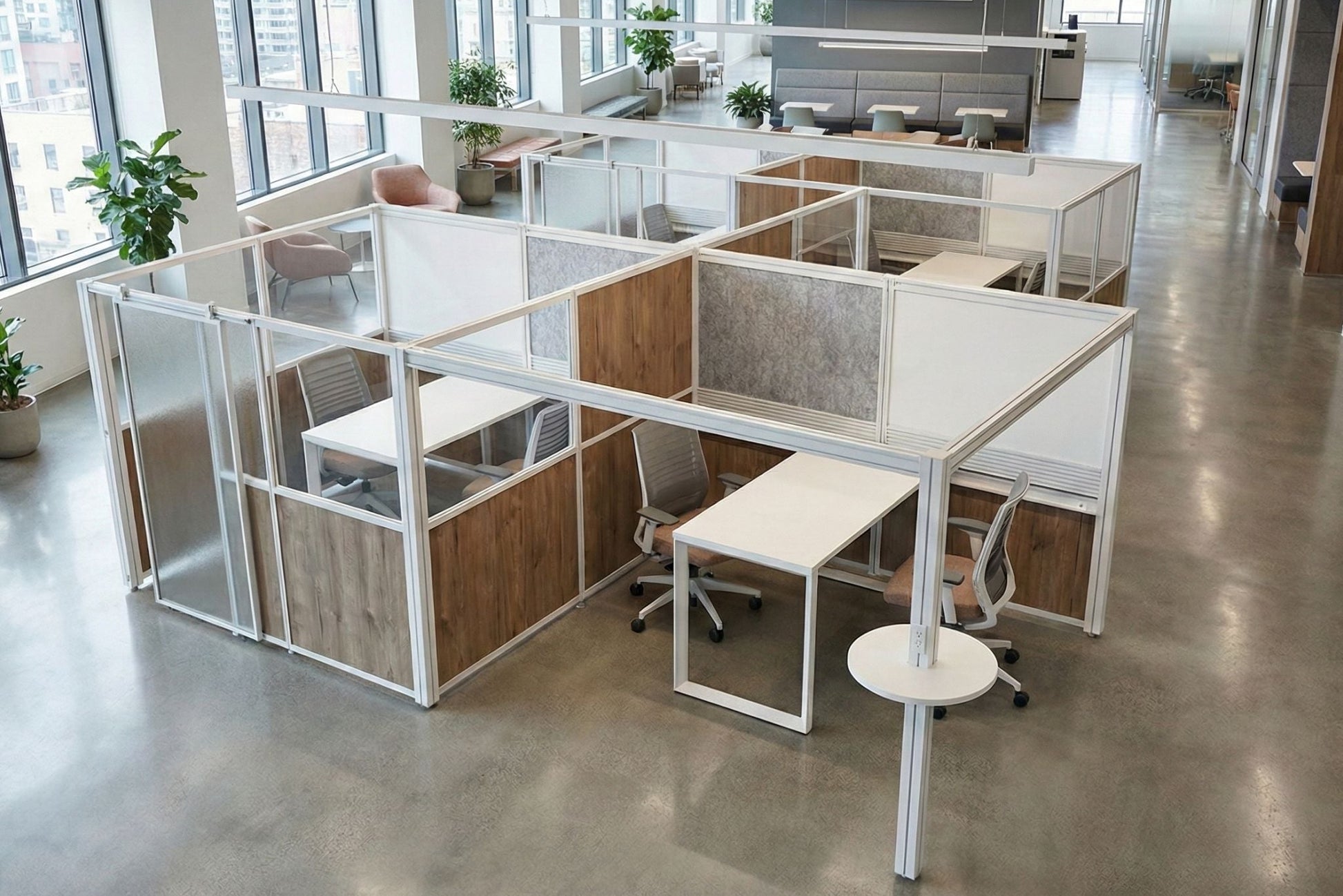 Modern office layout with glass-walled workstations and chairs.