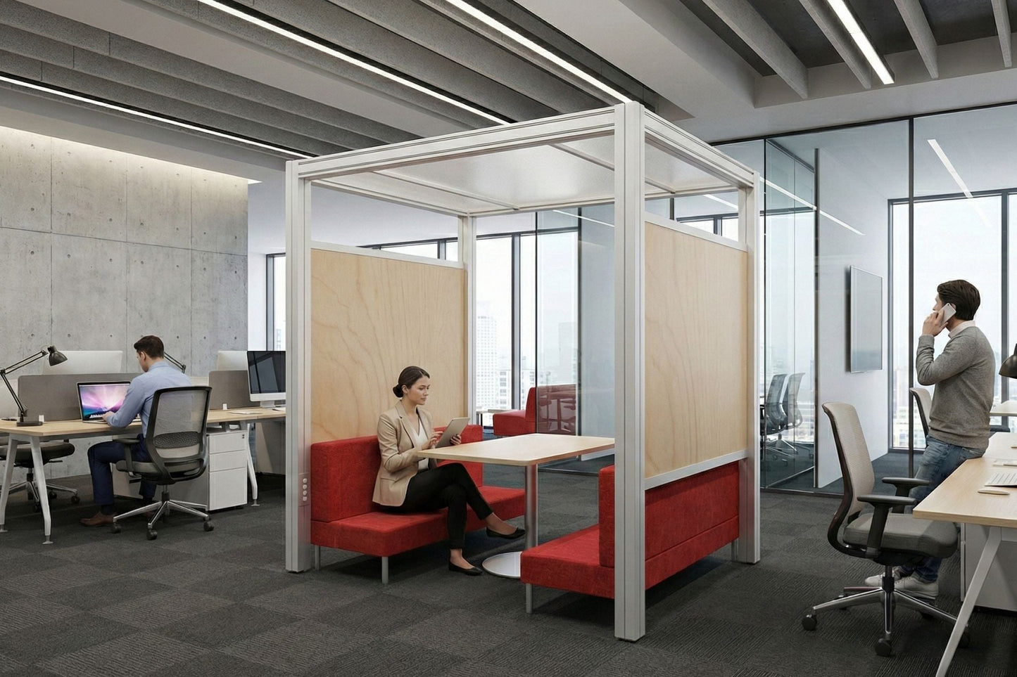 Modern office space with glass partitioned workstations and red chairs.
