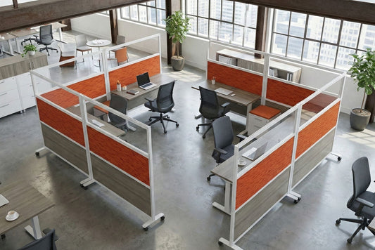 Modern office layout with orange and gray partitioned workstations.