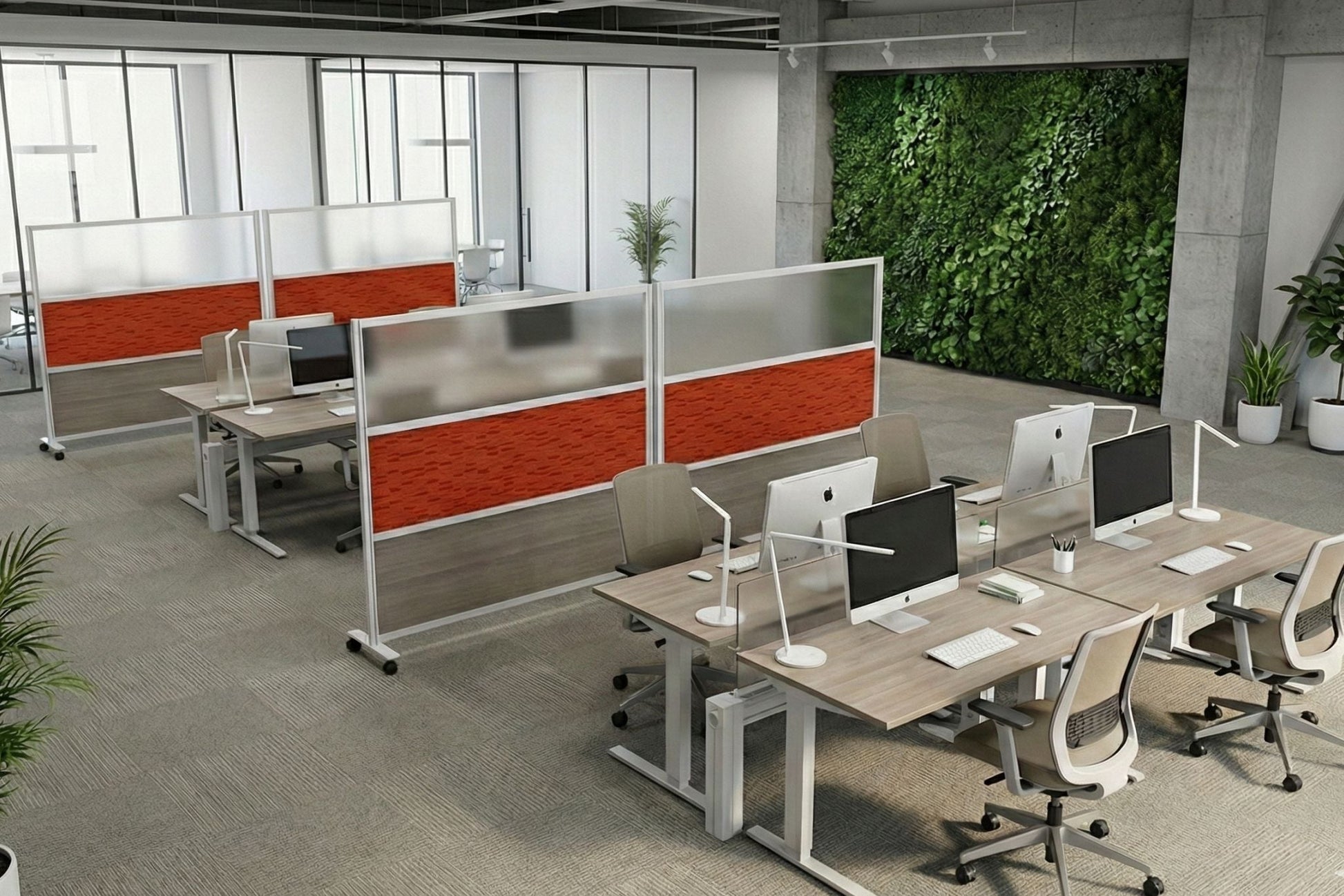 Modern office setup with desks, chairs, and computer monitors in a well-lit room.
