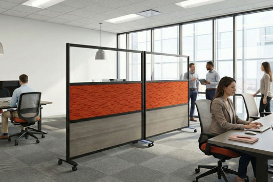 Modern office with workers at their desks and a movable partition screen.