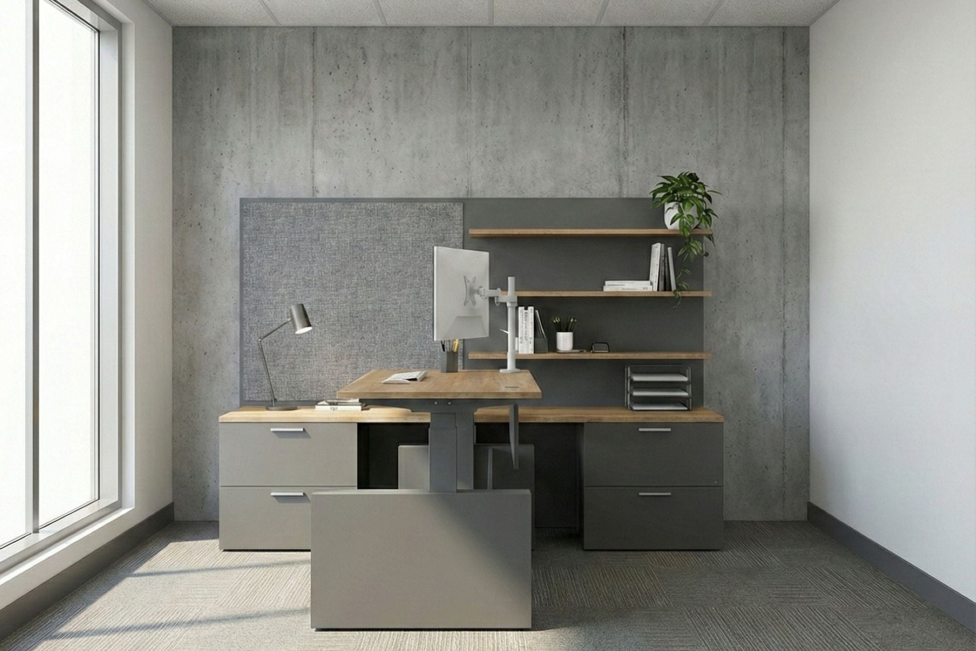 Modern office desk setup with shelves and a window in a room with concrete walls.