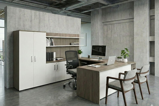Modern office setup with a desk, chairs, and office furniture in a concrete-walled room.